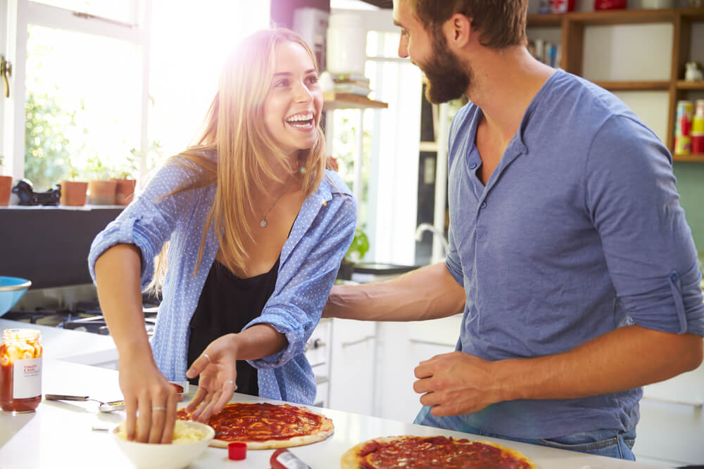 Couple making pizza
