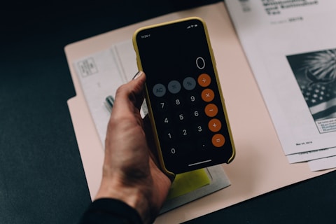 woman with calculator on her phone