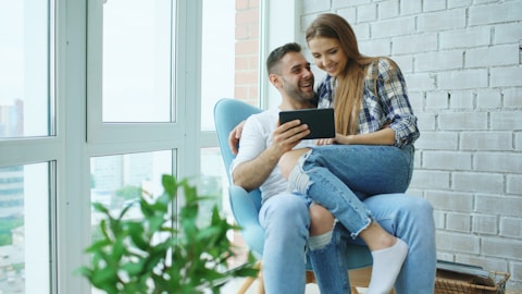 couple happy sitting on chair