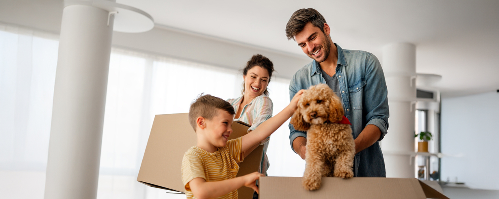 family photo with dog and boxes